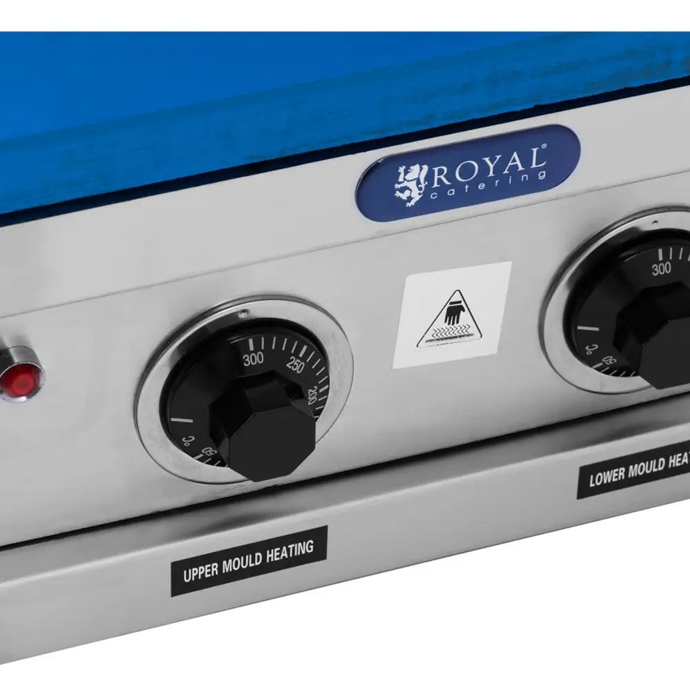 Waffelmaker for iskremvafler, nærbilde av to svarte temperaturbrytere med graderingsskala og varselskilt.