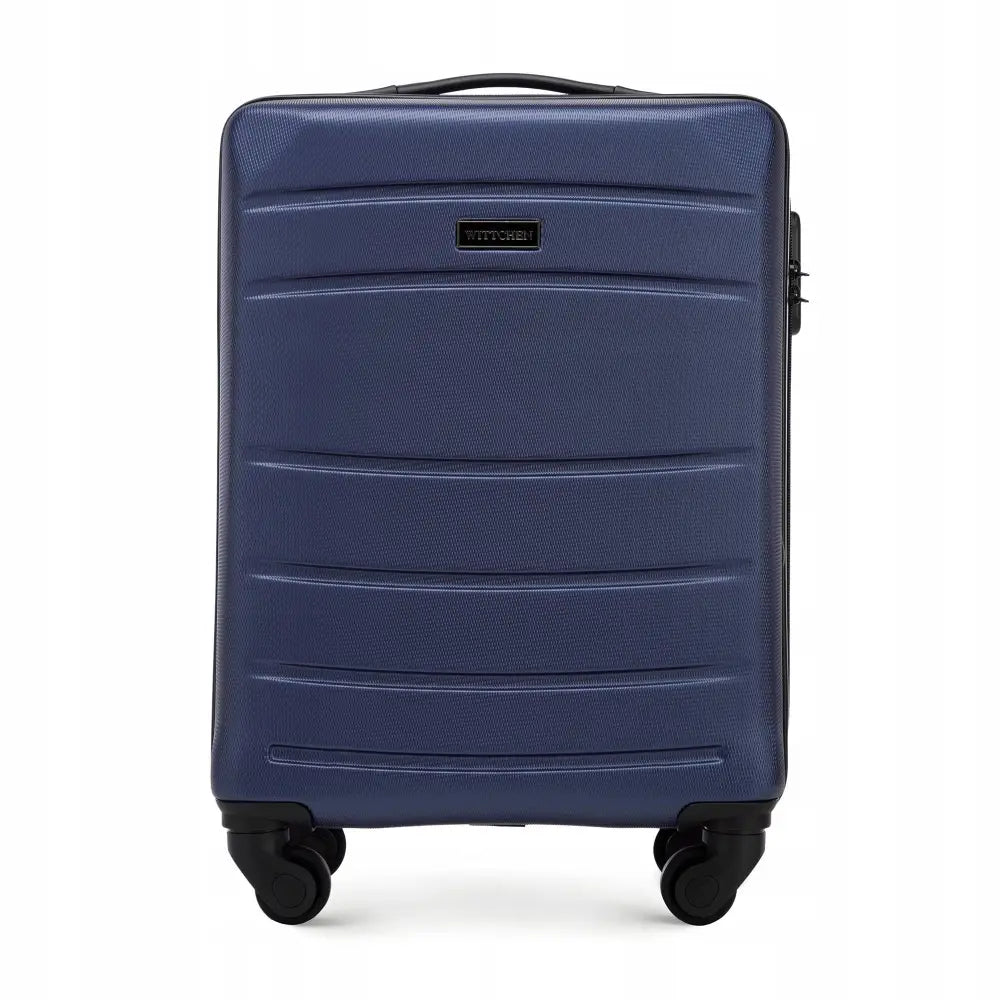 Wittchen kabinkoffert i matt mørkeblå ABS, frontvisning med fire hjul og sort topphåndtak.