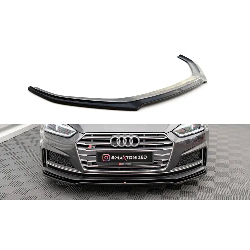 Audi A5 (F5) 16-24 - Deler Og Tilbehør, svart frontspoiler alene og montert på en grå Audi parkert på rutet gulv.