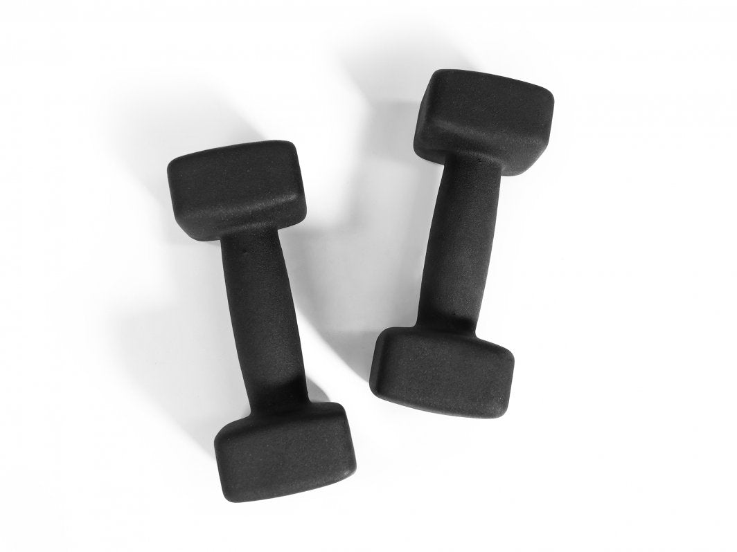 Håndmanualer i svart neopren med rektangulære vektskiver, sett ovenfra mot hvit bakgrunn.