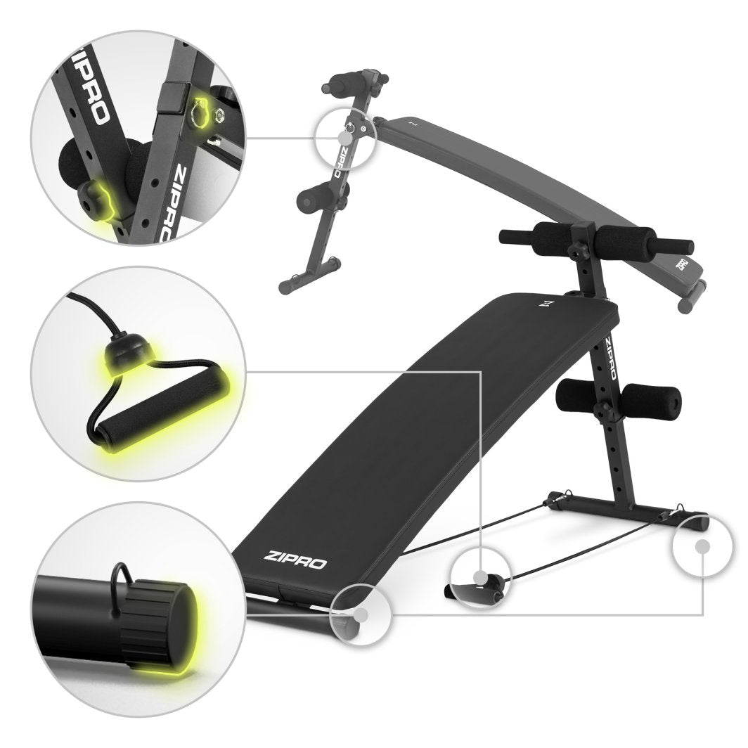 Sammenleggbar Treningsbenk sett fra siden med skumdetaljer, justeringsmekanismer, strikkhåndtak og endekapsel.