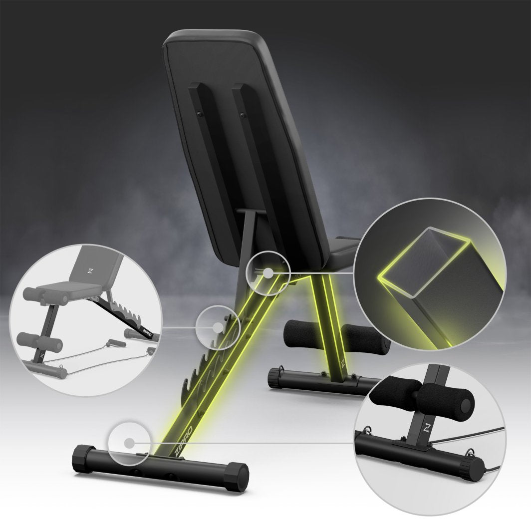 Sammenleggbar Treningsbenk i sort metall med polstring, sett skrått bakfra, viser ramme, justeringshakk og benstøtter.