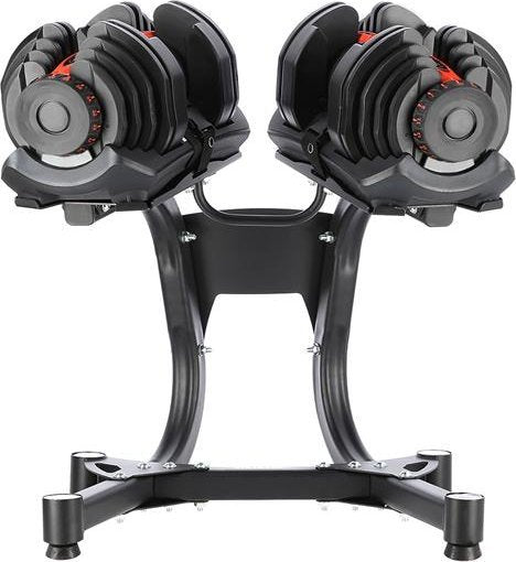 Justerbare Manualer i svart plast og metall på robust stativ, sett forfra med røde vektmarkeringer synlige.