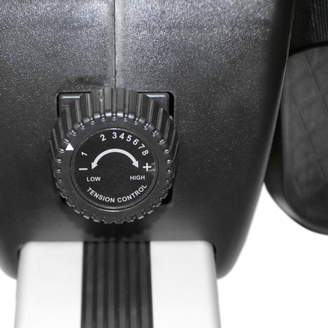 Romaskin Sammenleggbar sort plastdreiehjul med tallskala fra 1 til 8 for motstandsjustering, nærbilde.