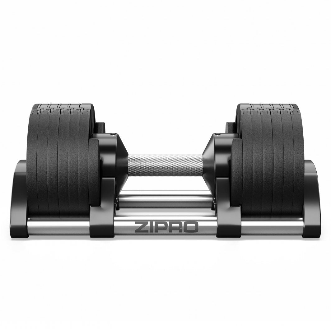 Justerbara Hantlar i sort og sølv sett forfra, metallhåndtak med grep, flere vektplater, står i ZIPRO-stasjon.