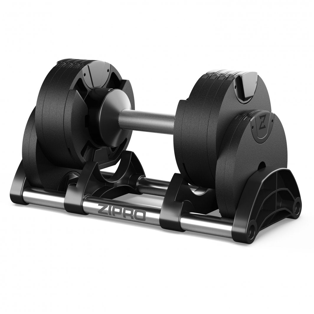 Justerbar Hantel i svart plast og metall på stativ, sett fra skrå vinkel med synlig håndtak og vektskiver.