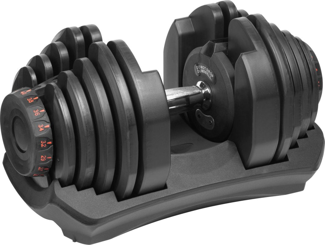 Manual Manual justerbar i svart og sølv metall ligger i holder, røde vektmarkeringer synlige på siden.