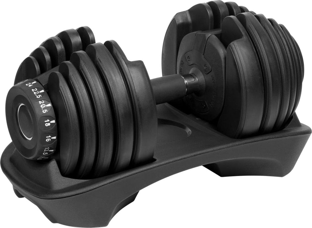 Justerbar Manual i sort plast og metall i stativ, med synlig dreieskive for vektjustering, sett fra siden.