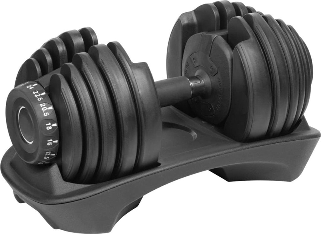 Justerbar Manual i svart metall og plast, sett fra siden i stativ med synlig vektmarkering på vektskivene.