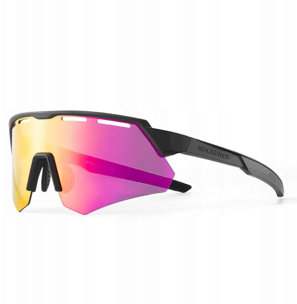 Sykkelbriller med store, speilende glass i rosa og oransje, svart ramme og ventilasjonsåpninger, sett fra siden.