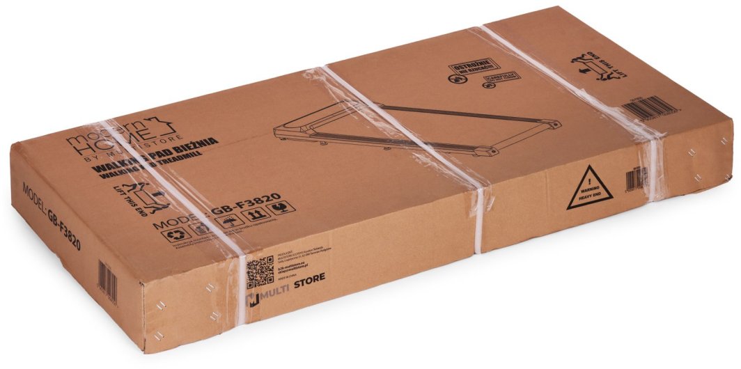 Walkpad i rektangulær pappeske med sort tekst, tekniske illustrasjoner, plastbånd, etiketter og strekkoder.