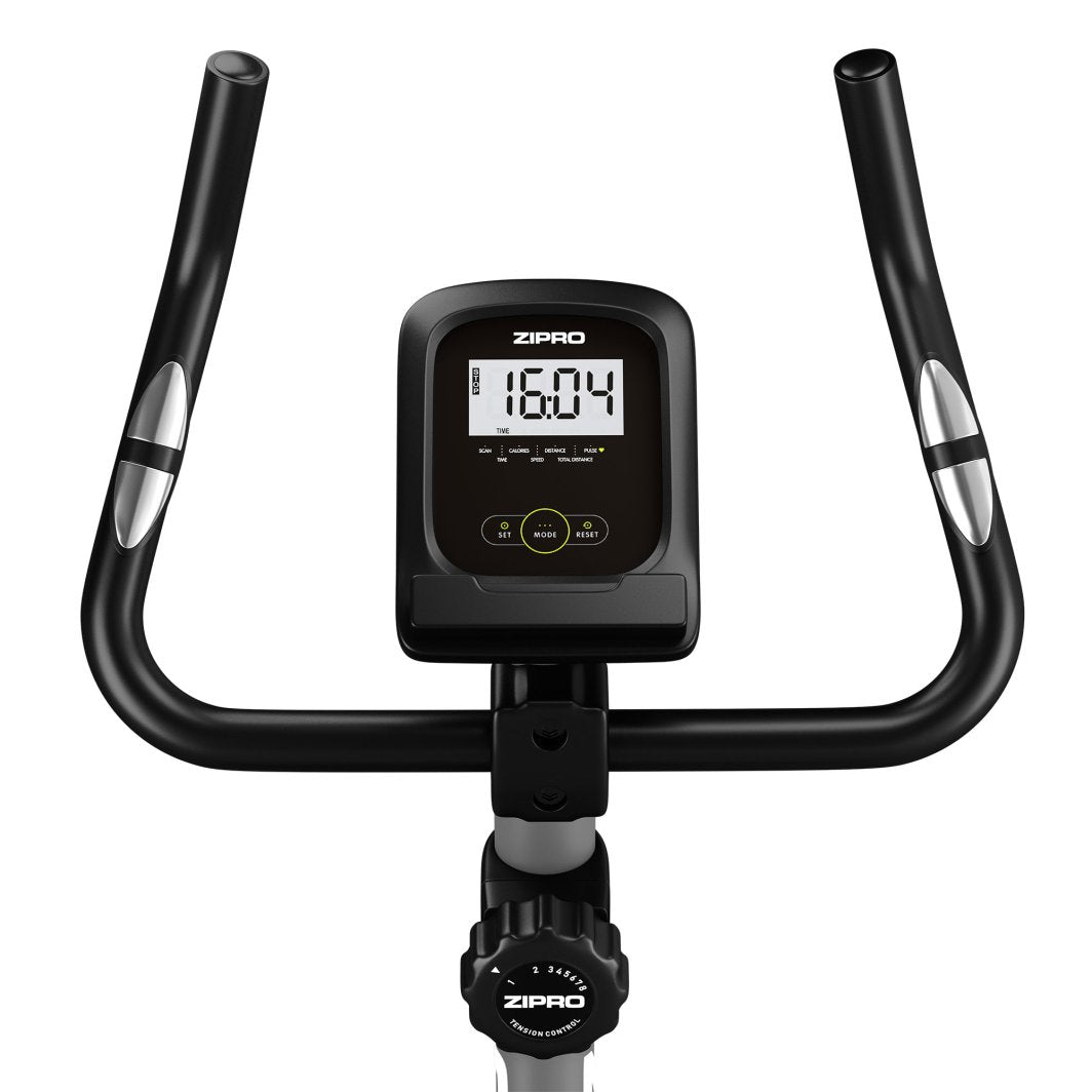 Ergometersykkel med svart styre, sølvdetaljer og stor digital skjerm sett forfra. Motstandsjustering vises under.