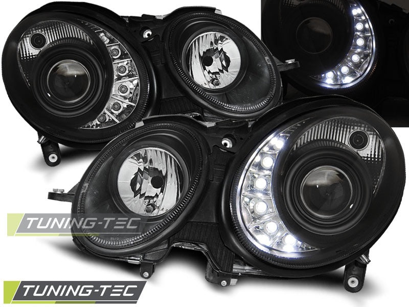 Frontlykter Xenon Daylight Black til Mercedes W211 03.02-04.06 sett rett forfra på hvit bakgrunn.