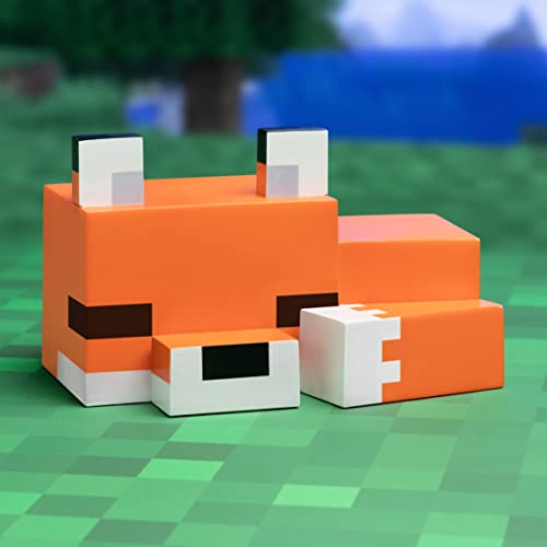 Bordlampe formet som en sovende Minecraft-rev i oransje, hvitt og svart plast, sett fra siden.