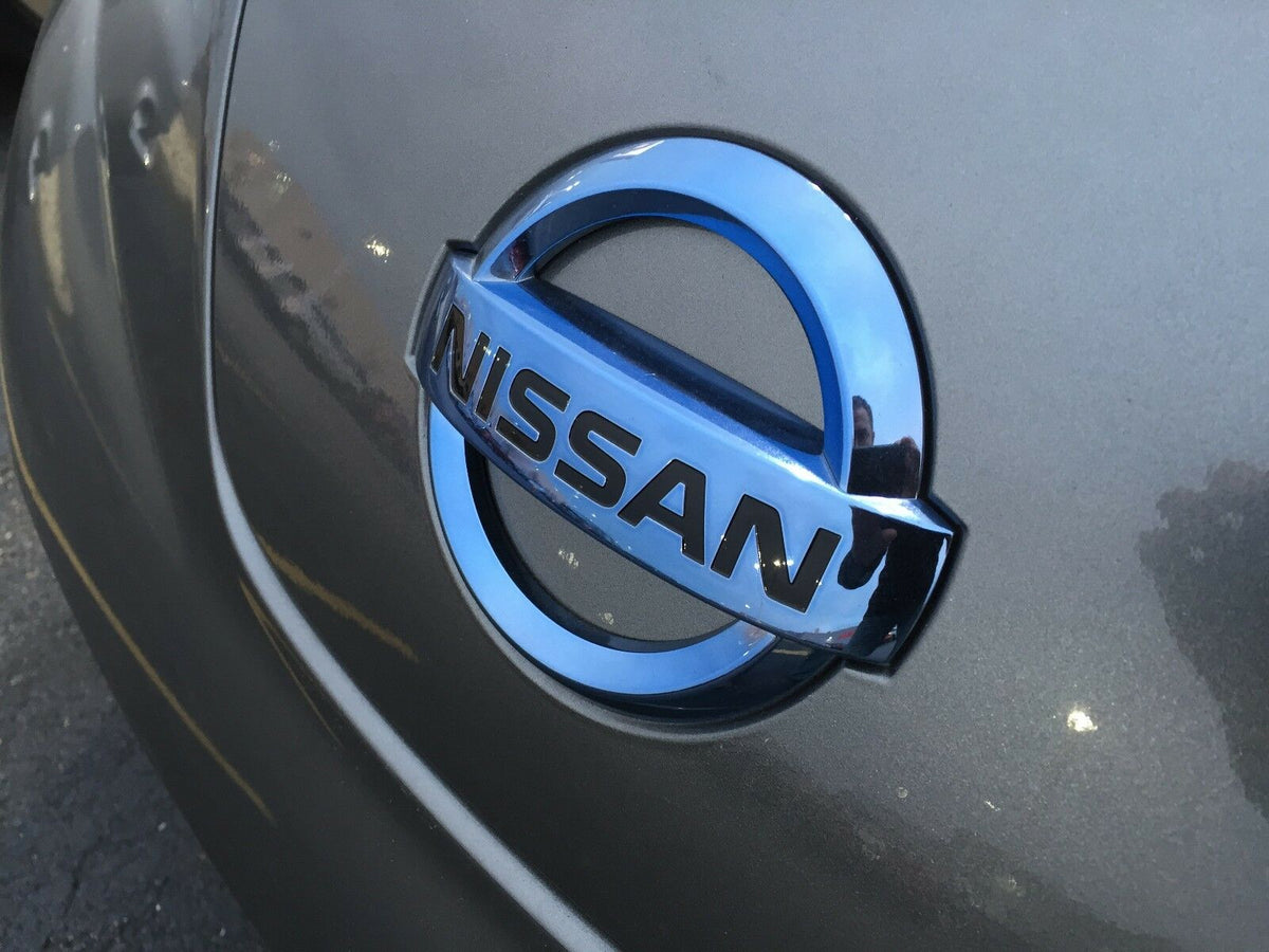 Emblem Nissan Leaf I (ZE0) / Nissan e-NV200 2014 - 2021 | Nissan Motor Company - sett forfra