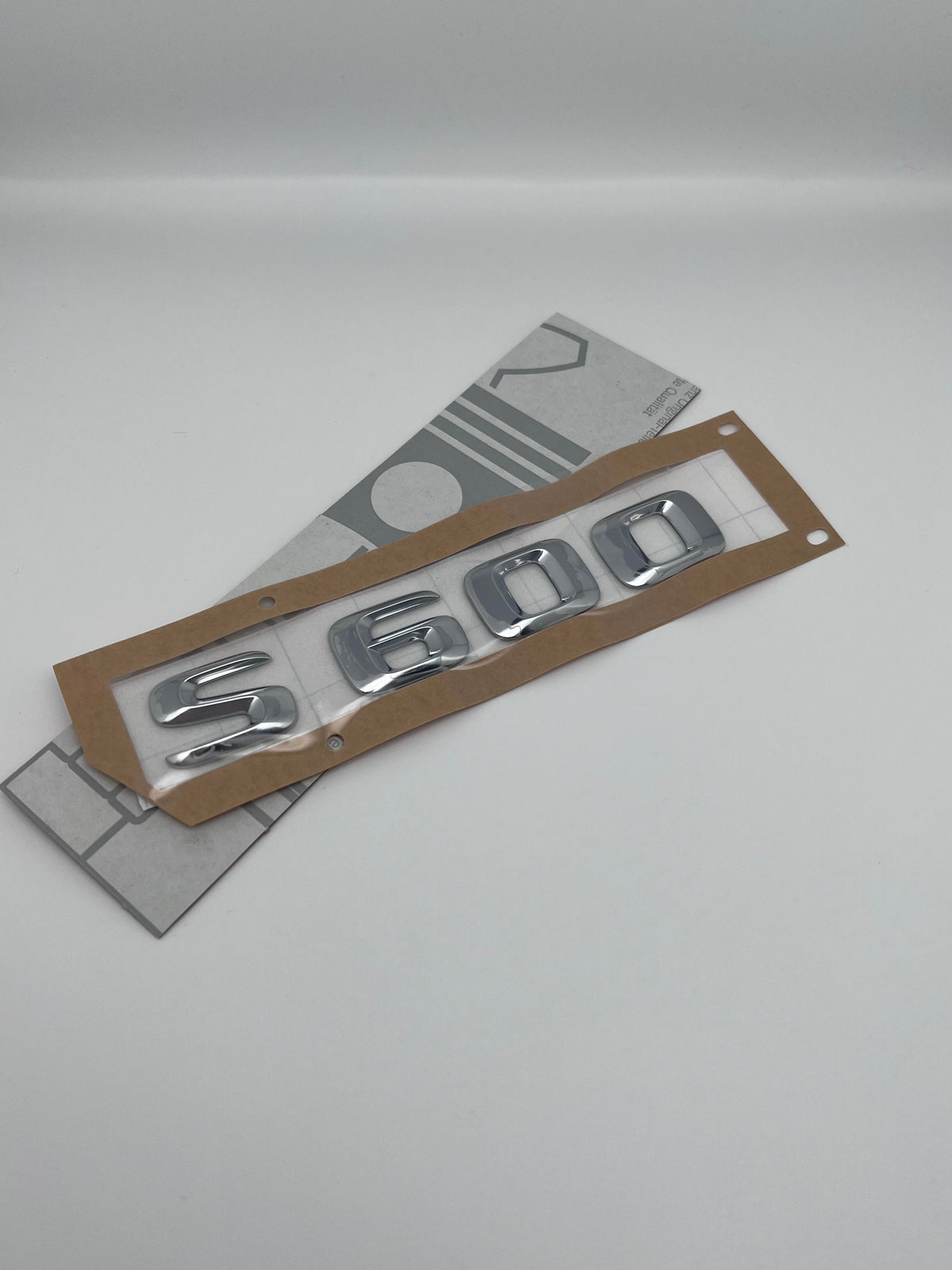 Emblem Mercedes Baklukelogo S600 A222817 - sett forfra