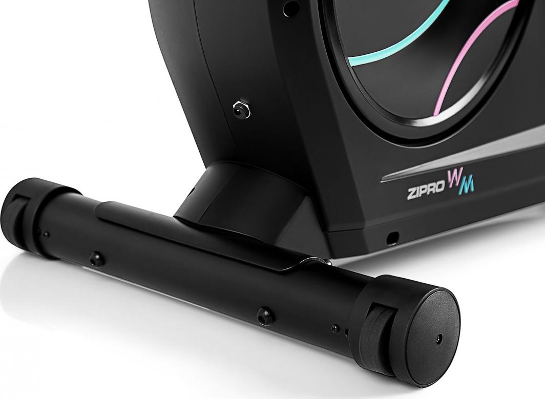 Ergometersykkel liggende modell med komfortsete, digital skjerm og solide pedaler, sett fra siden.