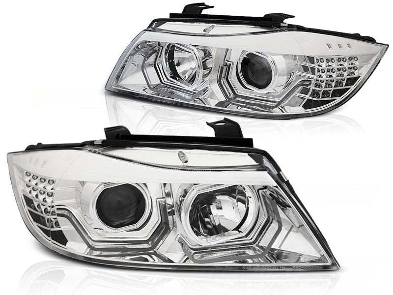 Frontlykter Angel Eyes LED 3D Chrome til BMW E90/E91 05-08 sett rett bakfra på hvit bakgrunn.