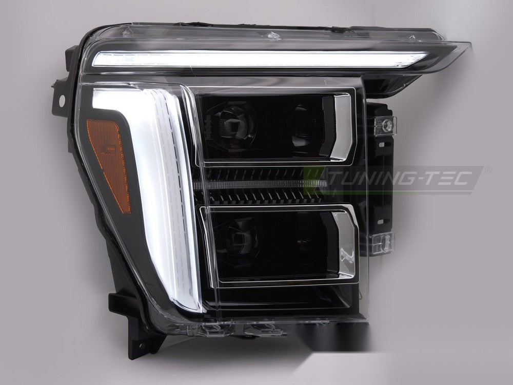 Detaljbilde av frontlykter til Ford F150 MK14 (XIV) med LED-detaljer synlige.
