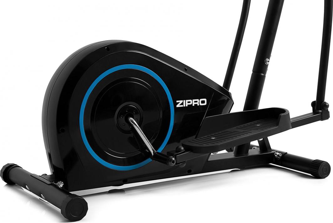 Ellipsemaskin i sort med blå detaljer, sett fra siden, viser fotplate, svinghjul og pedal tydelig.