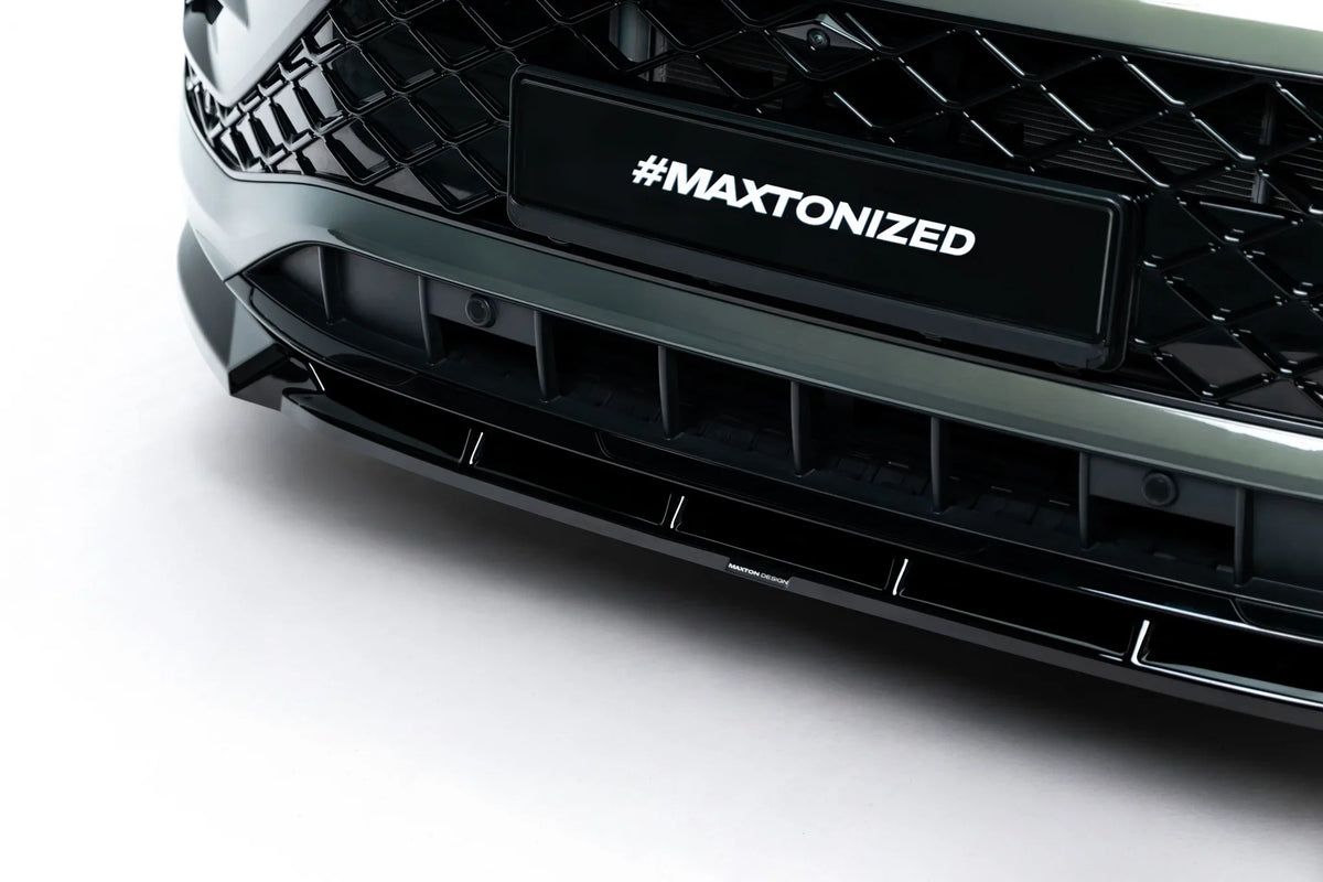 Detaljbilde av kant og underside på frontsplitter til Tayron Mk1