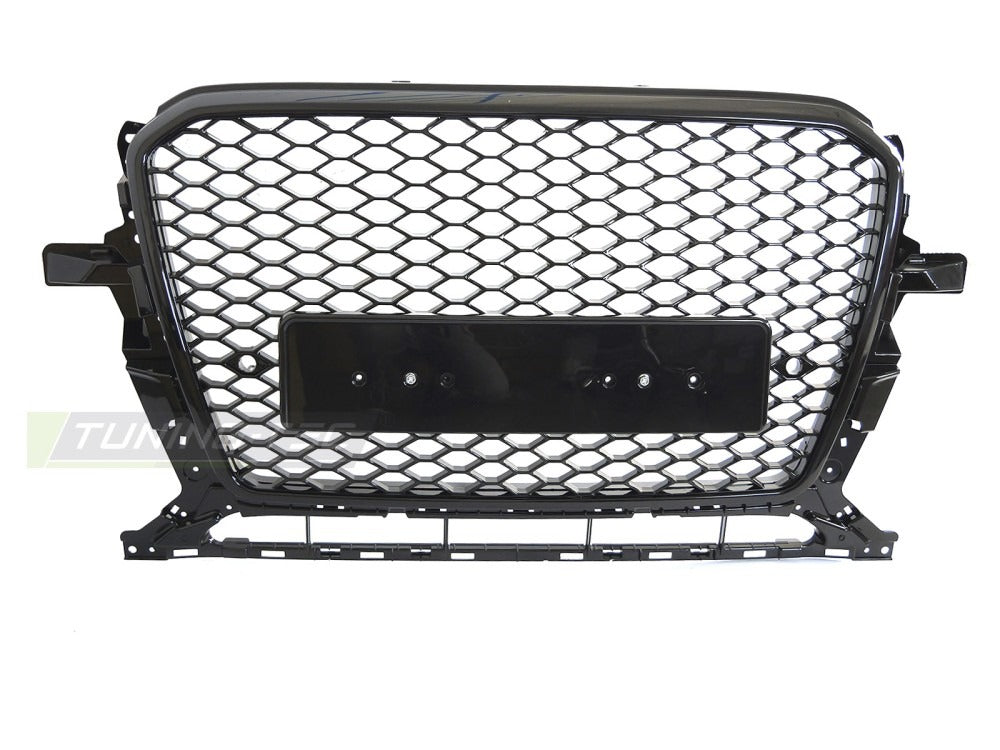 Nærbilde av detaljer på grill til Svart Audi Q5 8R 12-16