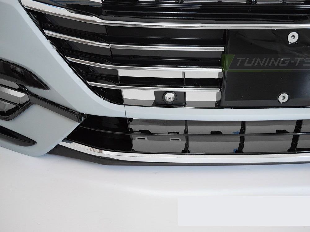 Detaljvisning av tåkelysåpninger og ventilasjonsgitter på Arteon sport frontfanger