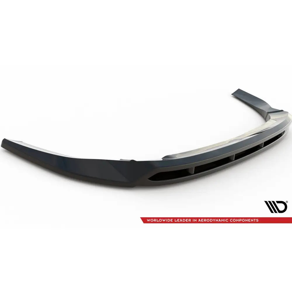 Front lip til Ford Tourneo Custom Mk1 Facelift, sort plast med luftkanaler, sett skrått ovenfra på hvit bakgrunn.