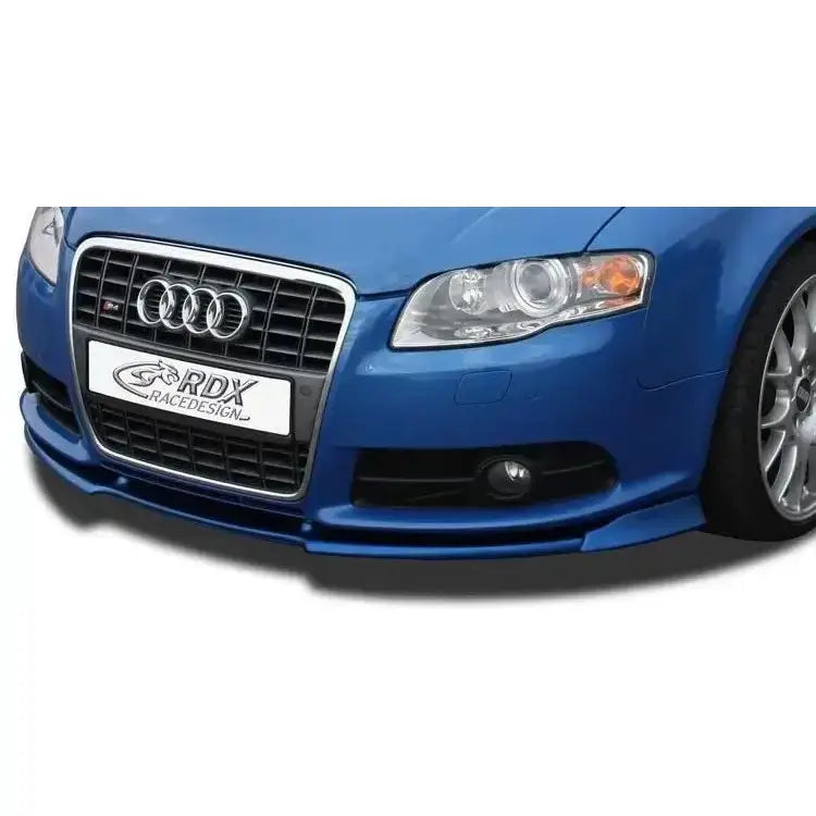 Frontleppe Audi A4 8E B7 S-Line, blå bil sett forfra med sølv grill, hovedlykter og tåkelys.
