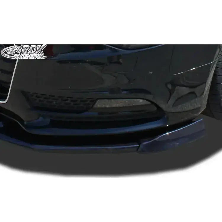 Frontsplitter Audi A5 11-16 Coupe/Sportback i sort glanset finish nær venstre hjul, skrått forfra.