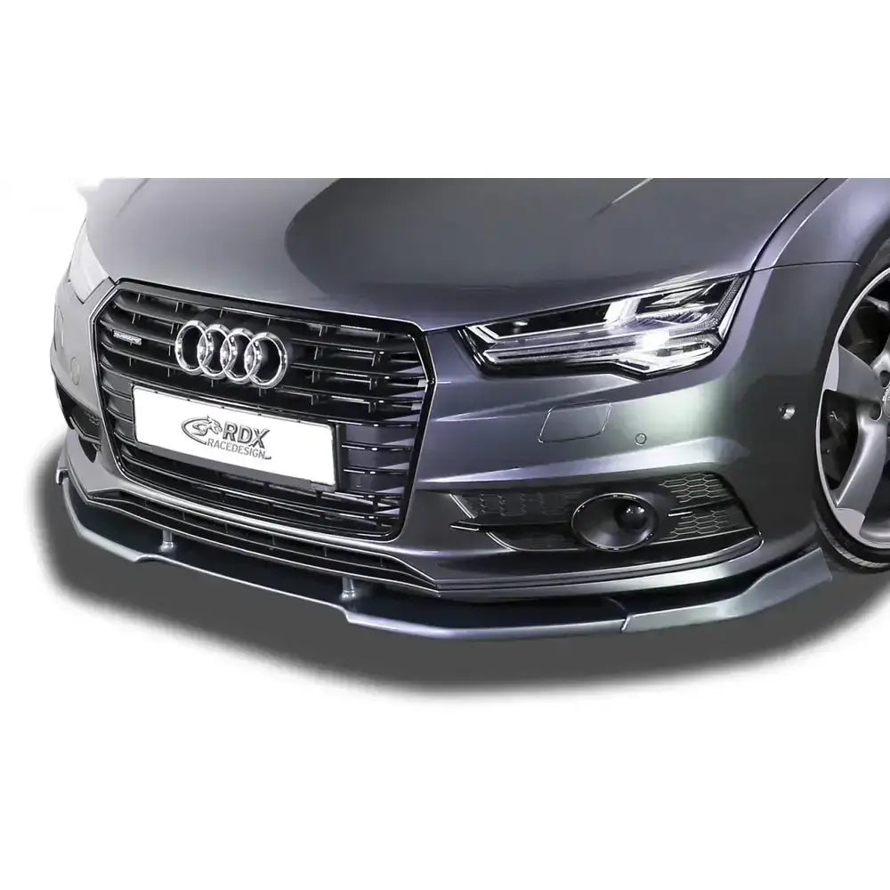 Frontleppe til Audi A7 S-Line 2014-2018, mørk grå spoiler montert på støtfanger, nærbilde.