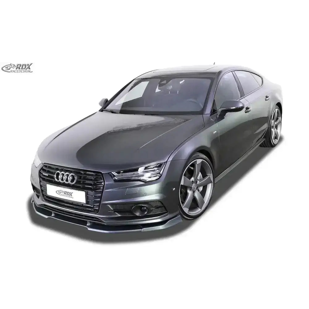 Frontspoiler på Audi A7 S-Line med store aluminiumsfelger og tonede ruter mot hvit bakgrunn.