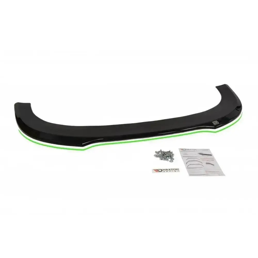 Front splitter Audi Rs6 C6 i sort plast med grønn kant, sett ovenfra, med skruer og monteringsanvisning.