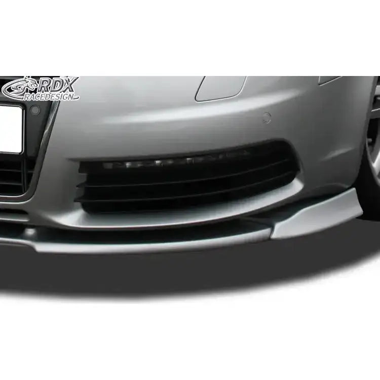 Front splitter Audi S6 4F 04-11 i sølv, nærbilde av aerodynamisk frontspoiler under svart grill.