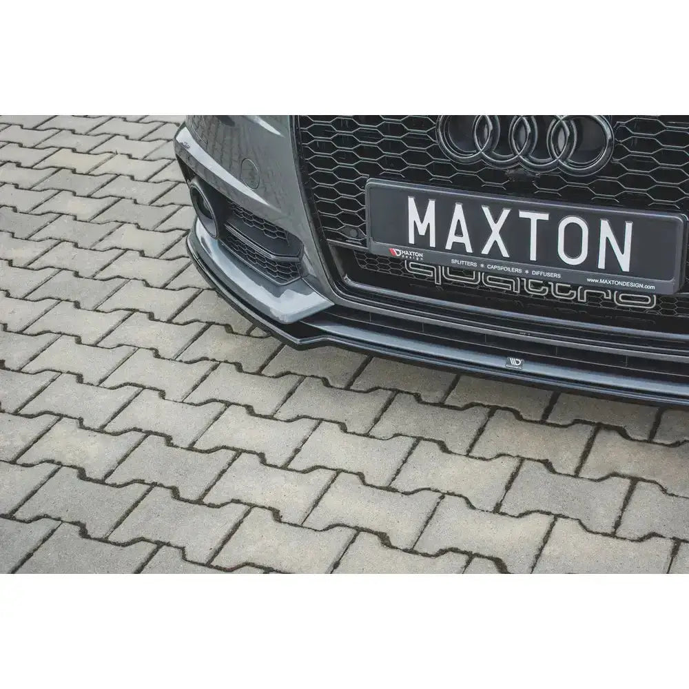Frontleppe Audi S6 S-Line C7 FL i blank finish montert på bil, detaljert visning mot belegningsstein.
