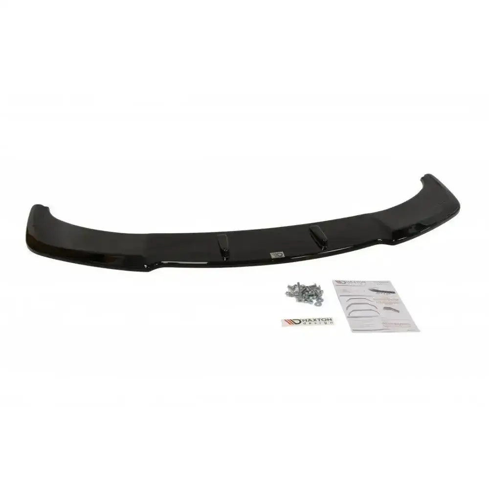 Front lip til BMW 6 Gran Coupé Mpack, svart buet spoiler med skruer og monteringsveiledning ved siden av.