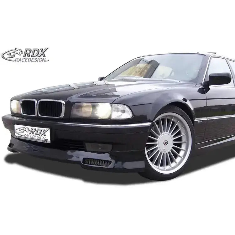 Frontspoiler til BMW 7 serie E38 94-01 montert på sort bil med aluminiumsfelger og store frontlykter.