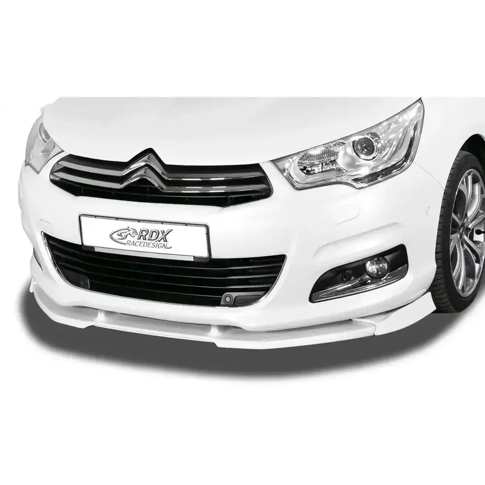 Frontleppe Citroen C4 hvit spoiler montert under støtfanger, sett forfra med svart grill og lykt.