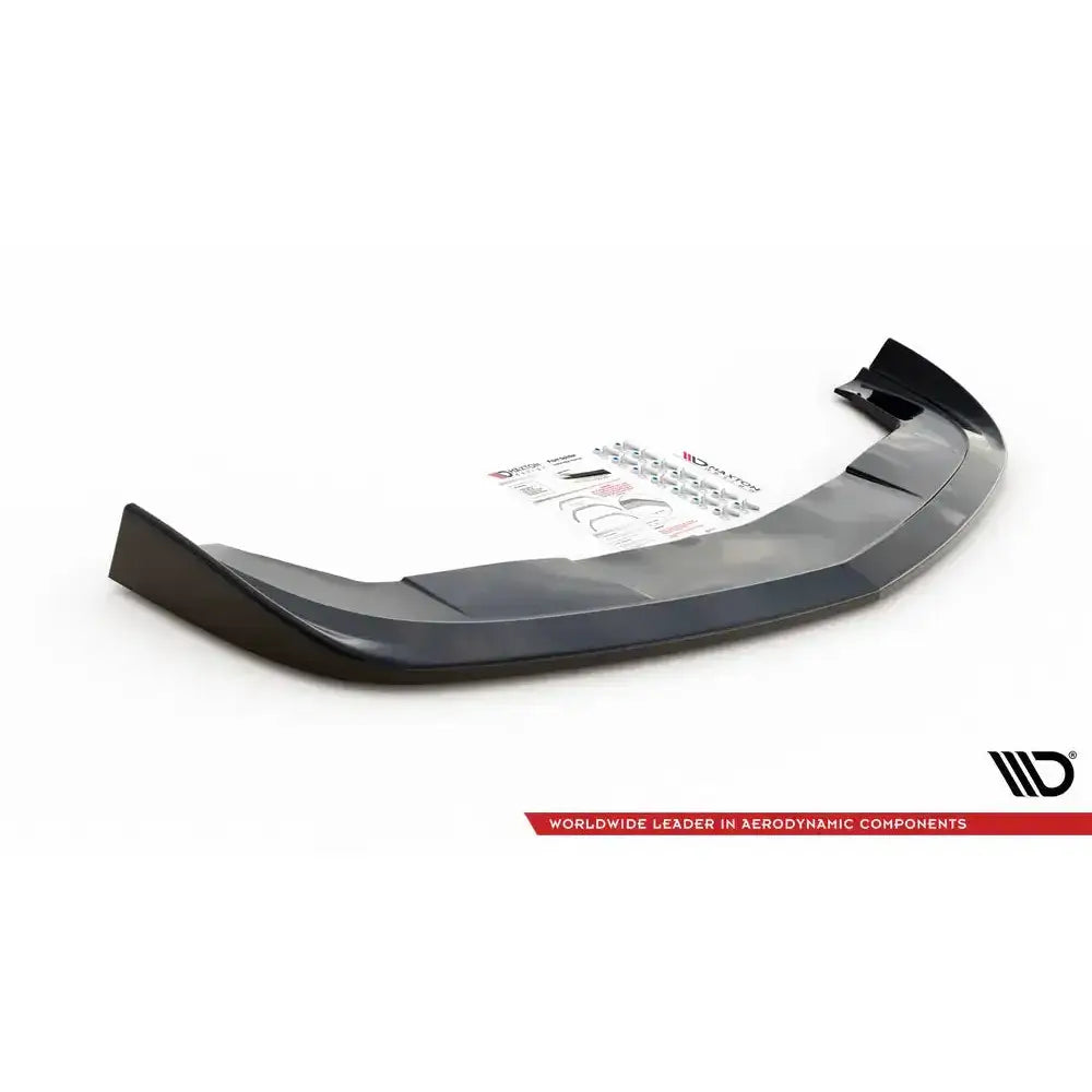 Front splitter til Dodge Challenger RT Mk3, svart plast med monteringsutstyr og instruksjoner bak.