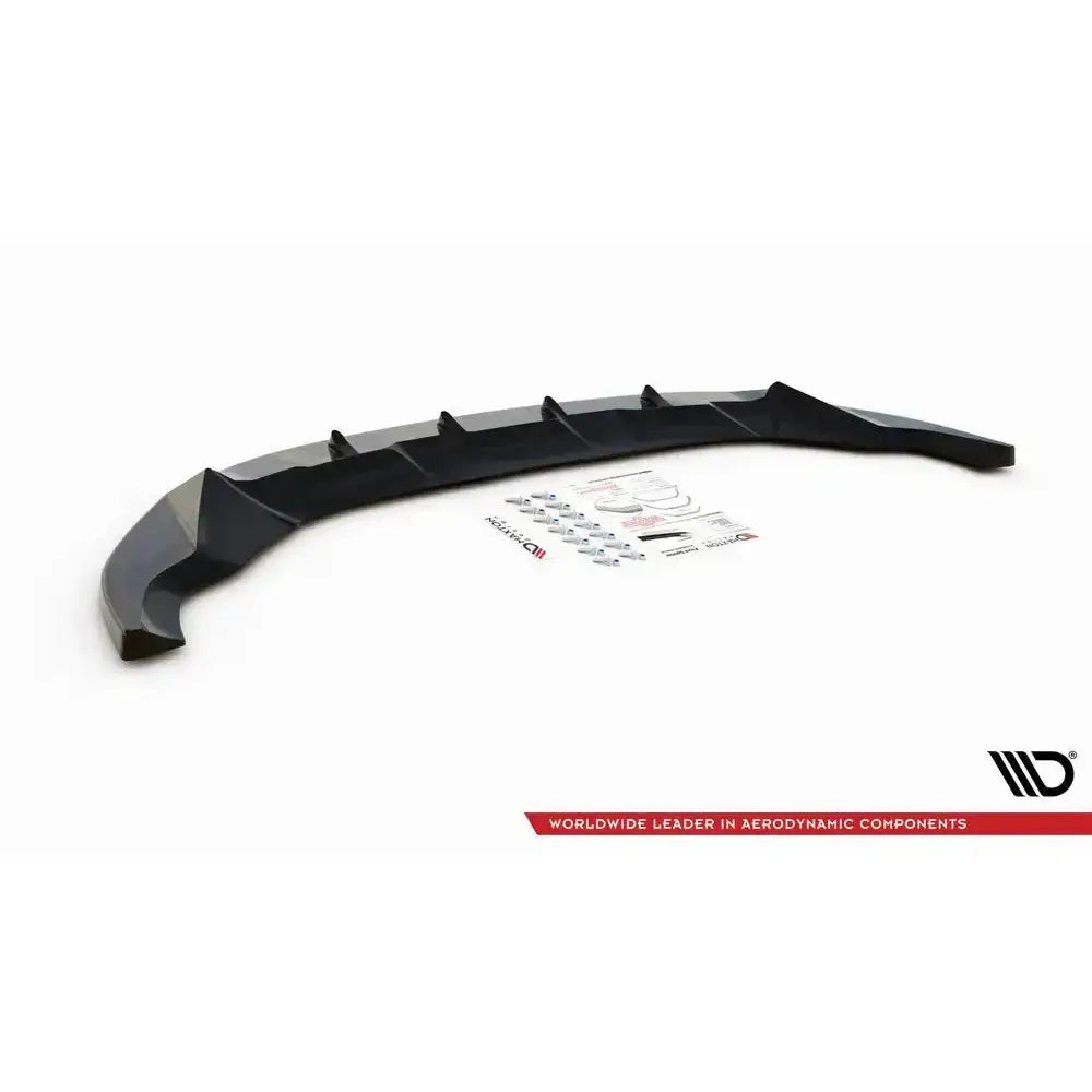 Front splitter til Ford Escape Mk3 12-19, sort plastdel med fester og klistremerker på hvit bakgrunn.