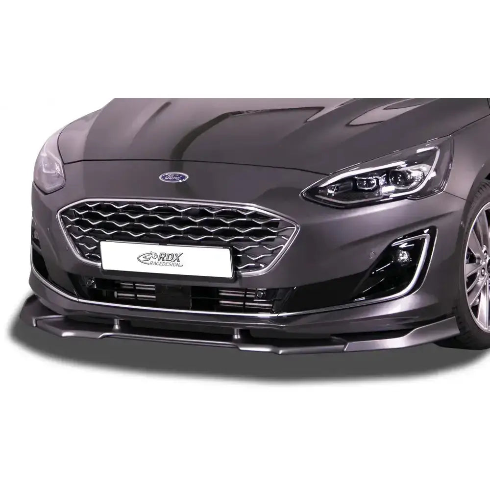 Frontleppe Ford Focus 4 Vignale Vario X i sort plast montert på grå bil med kromdetaljer og frontlykter.