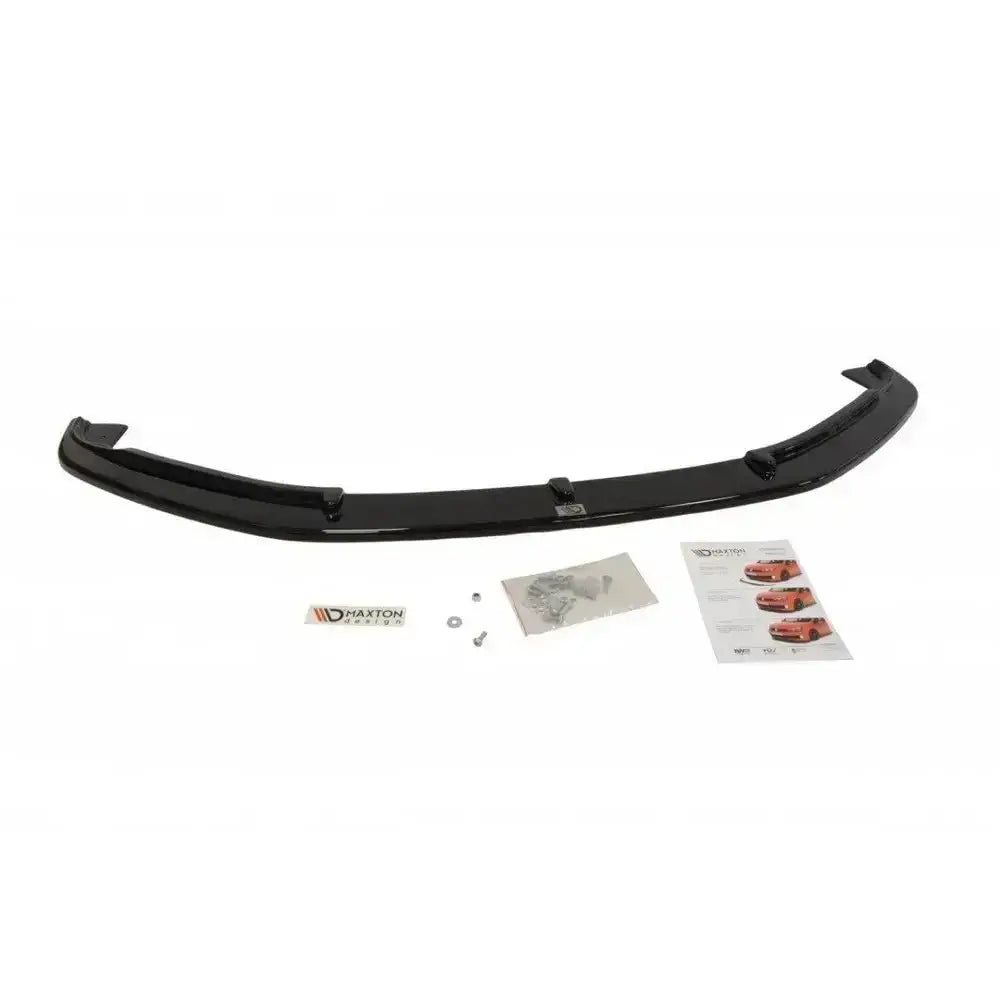Frontspoiler Jaguar Xf X250 facelift i sort plast, sett ovenfra med monteringsutstyr og instruksjonsark.