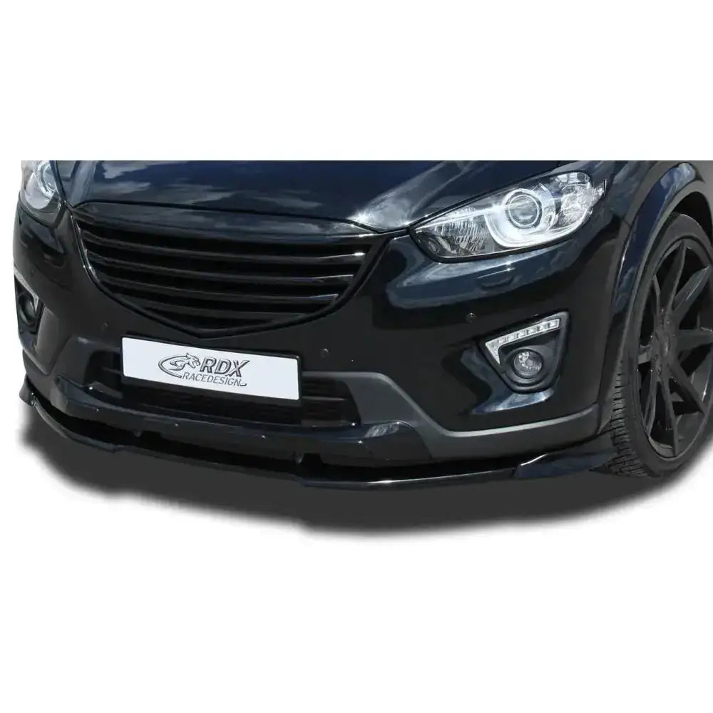 Frontleppe Mazda CX5 11-16 Vario X montert på sort bil med synlig frontsplitter og markerte linjer.
