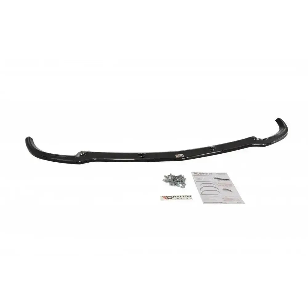 Front lip Mercedes C W204 Amg-Line sort spoiler sett fra oven med skruer og instruksjonsark på hvit bakgrunn.