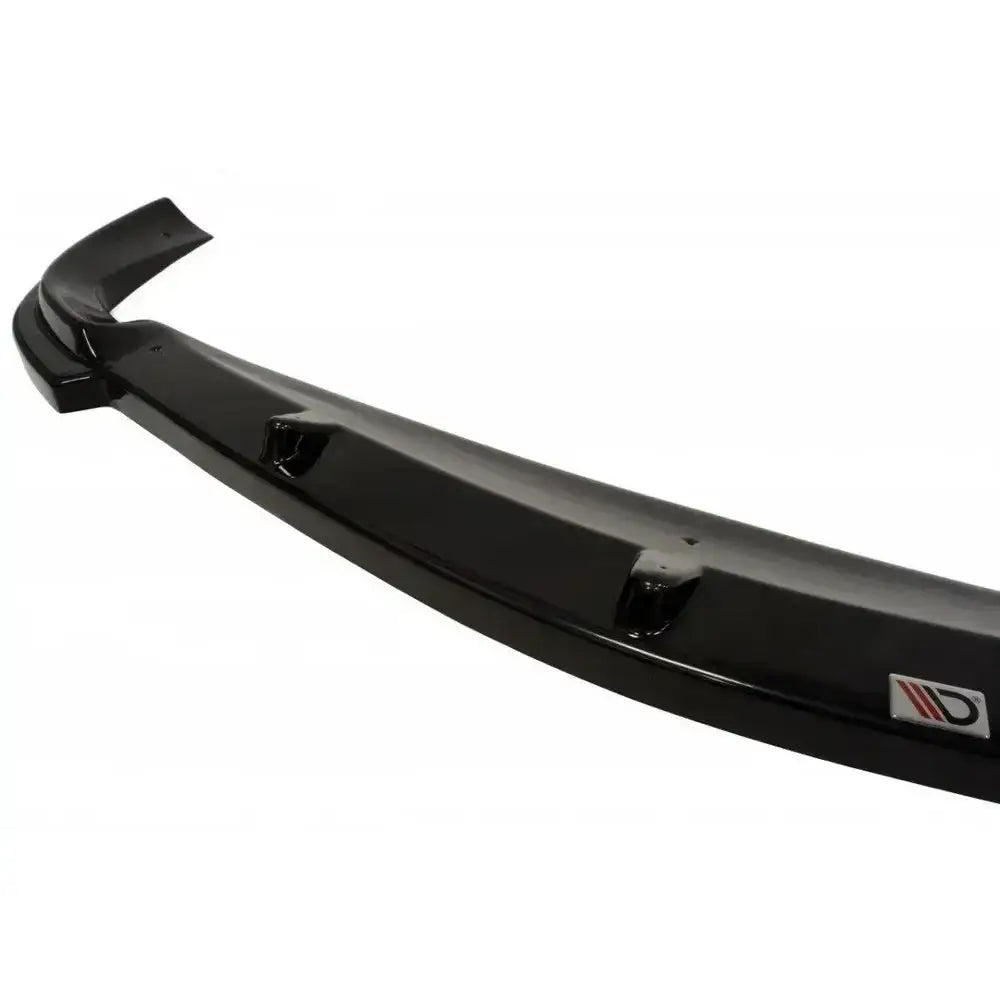 Frontsplitter til Mercedes Clk W208 i sort glanset finish, skrå vinkel, synlige monteringspunkter og logo.