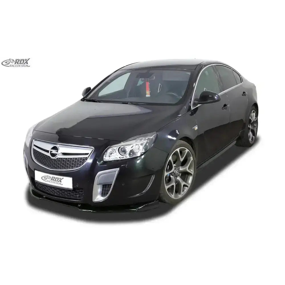 Frontspoiler Opel Insignia 08-13 OPC Vario X montert på svart bil med kromgrill og store felger.