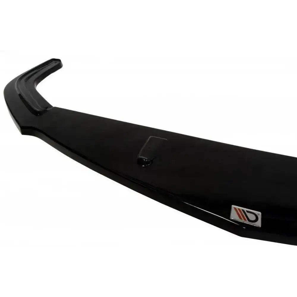 Frontsplitter til Opel Zafira B OPC/VXR i sort, blank plast sett fra skrå vinkel med logo nederst.