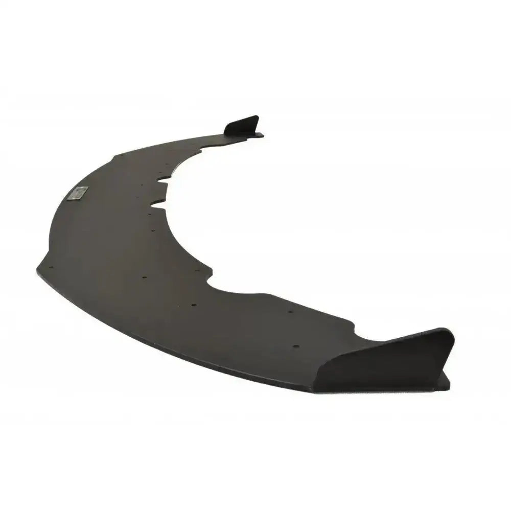 Front lip til BMW 4 F32 M-Pack, svart med vinger og skruehull, sett skrått bakfra.