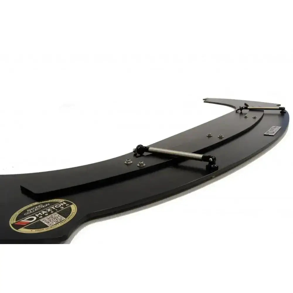 Front splitter Racing Vw Golf V Gti 30Th i sort plast med metallstag og synlig logo-klistremerke.