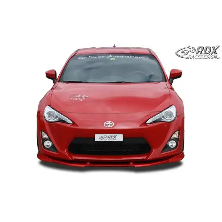 Frontspoiler på rød Toyota GT86 med svart frontsplitter og synlig RDX-logo på nummerskiltet.